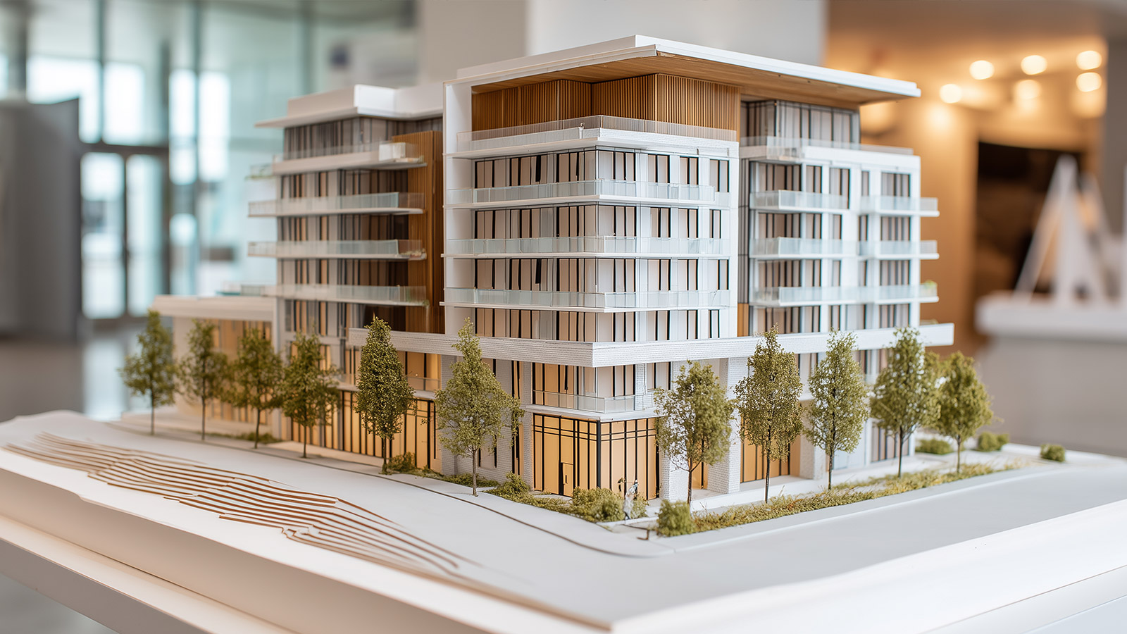 Immobilienvertrieb für Bauträger Modell eines modernen Wohngebäudes